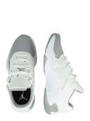 Jordan AJ11 CMFT Low Sneakers in White and Grey