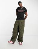 Tommy Hilfiger Chest Corp Stripe Logo T-Shirt in Black
