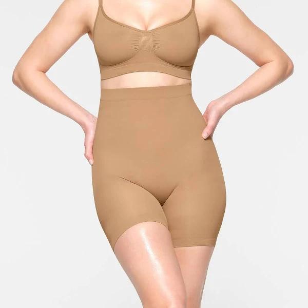 SKIMS Seamless Sculpt Mid Thigh Short in Ochre, Size XXS