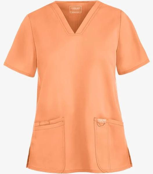 Cherokee Workwear Revolution Women's 3-Pocket Stretch V-Neck Scrub Top in Sweet Cantaloupe | Size M Polyester/rayon/spandex