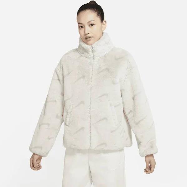 Nike All Over Swoosh Faux Fur Jacket in Light Bone and grey-Neutral