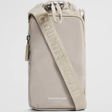 Country Road Recycled Nylon Drink Bottle Crossbody Bag in Sand