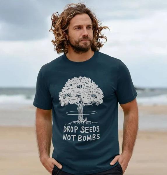 Rapanui Men's Drop Seeds Not Bombs T-Shirt | Size: XS | Denim Blue Certified Organic Cotton | Printed T-Shirt
